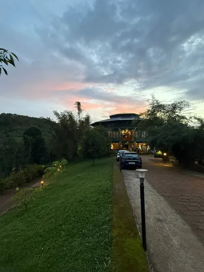 Jungle Edge Resort's exterior framed by Wayanad's hills